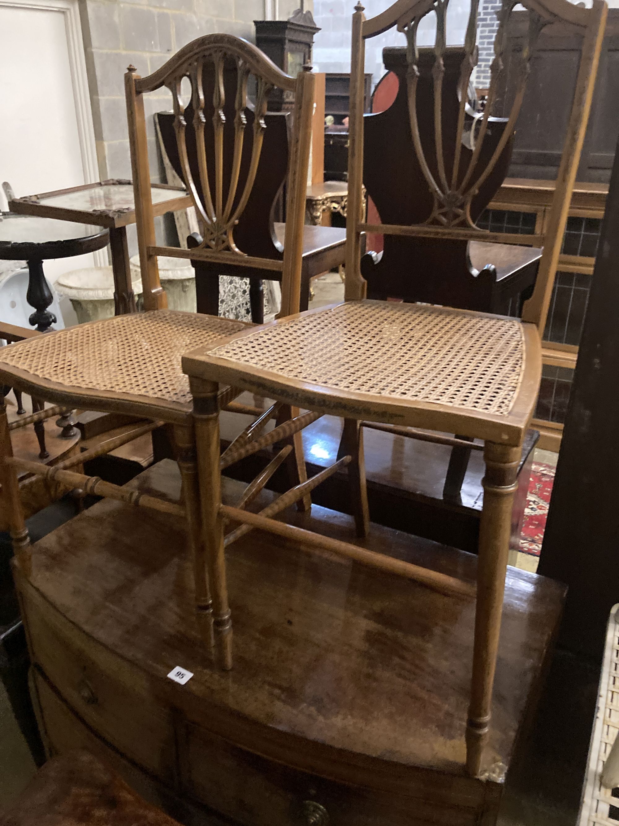 Two Edwardian cane seat chairs and a pair of painted Bentwood cane seat chairs